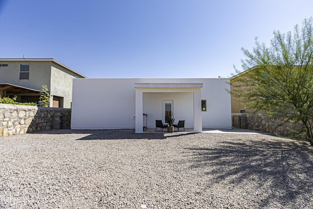 341 Sleepy Run St, El Paso, TX 79928 - rear view of property featuring stucco siding and a patio