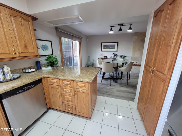 kitchen with dishwasher, light hardwood / wood-style flooring, kitchen peninsula, backsplash, and light stone countertops