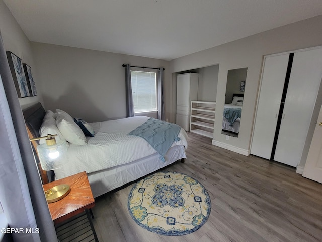 bedroom with hardwood / wood-style flooring