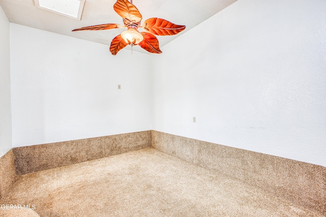 interior space featuring ceiling fan and carpet