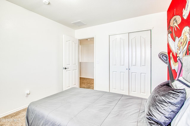 bedroom with carpet flooring and a closet