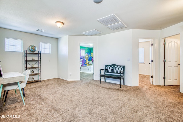 sitting room with carpet flooring