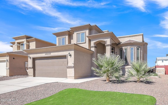 14805 Sam Garcia Ave, El Paso, TX 79938 - view of front of property with stucco siding, concrete driveway, and a garage