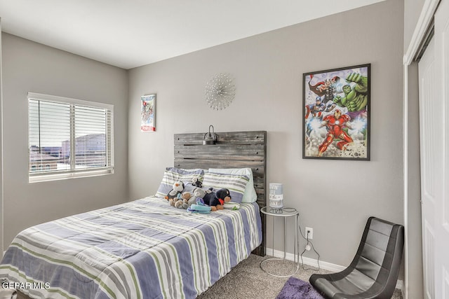 bedroom with a closet and carpet flooring