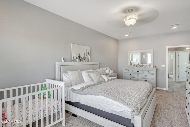 carpeted bedroom featuring ceiling fan