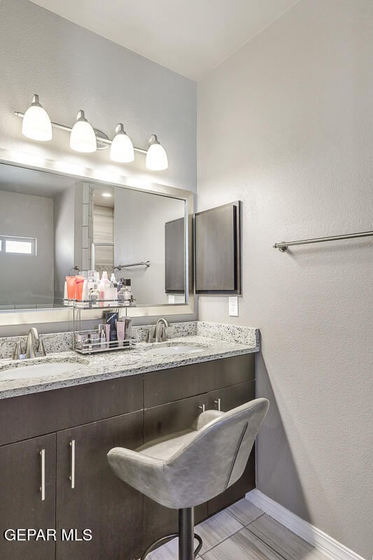 bathroom with vanity and tile patterned floors