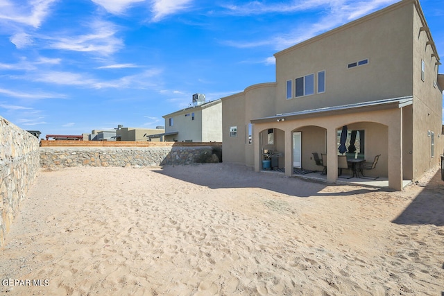 rear view of house with a patio area