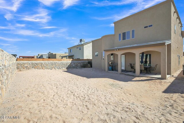 14805 Sam Garcia Ave, El Paso, TX 79938 - back of house with a patio, stucco siding, and a fenced backyard