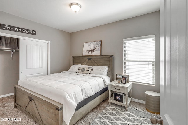 carpeted bedroom featuring a closet