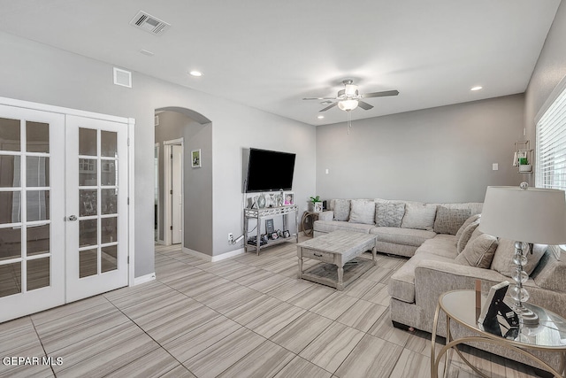 living room with french doors and ceiling fan