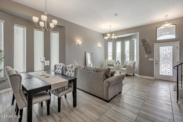 dining space featuring a chandelier