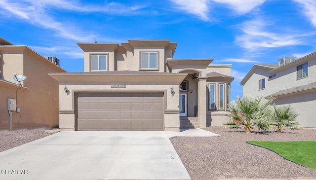 14805 Sam Garcia Ave, El Paso, TX 79938 - view of front of property with stucco siding, an attached garage, and concrete driveway
