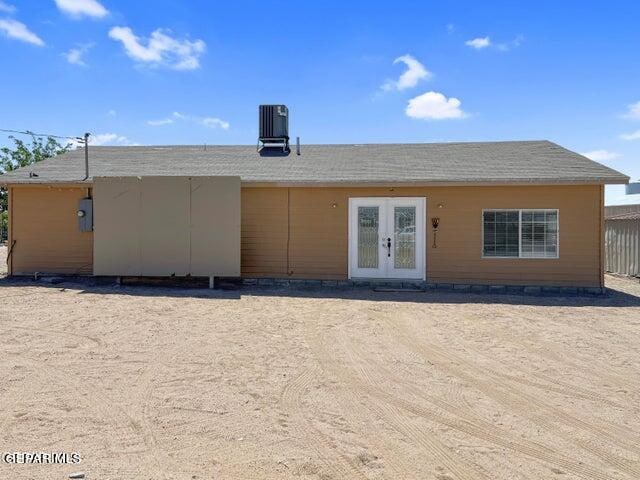 back of house with central air condition unit and french doors