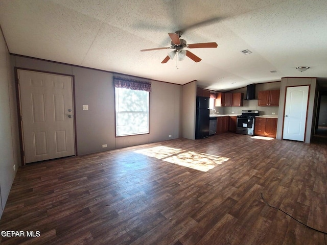 unfurnished living room with lofted ceiling, a textured ceiling, dark wood-type flooring, and ceiling fan