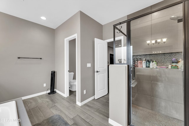 bathroom featuring toilet, independent shower and bath, wood-type flooring, and backsplash