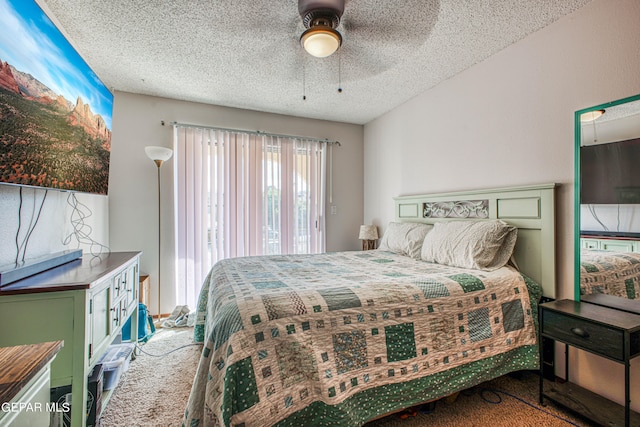 bedroom with carpet flooring, a textured ceiling, and ceiling fan