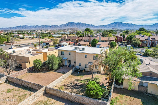 birds eye view of property with a mountain view