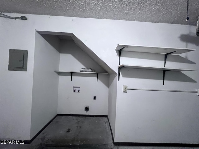 clothes washing area featuring washer hookup, electric dryer hookup, a textured ceiling, and electric panel