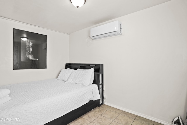 bedroom featuring a wall mounted AC and light tile patterned flooring