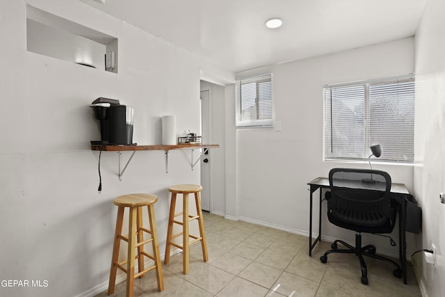 office space featuring light tile patterned flooring