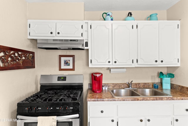 kitchen featuring sink, extractor fan, stainless steel range with gas cooktop, and white cabinets