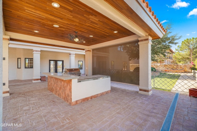 view of patio / terrace featuring area for grilling and ceiling fan