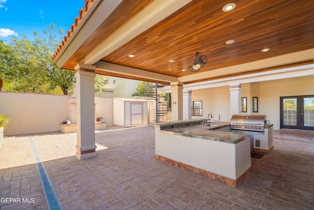 view of patio featuring grilling area, sink, and exterior kitchen