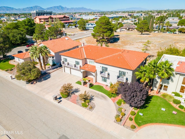 birds eye view of property with a mountain view