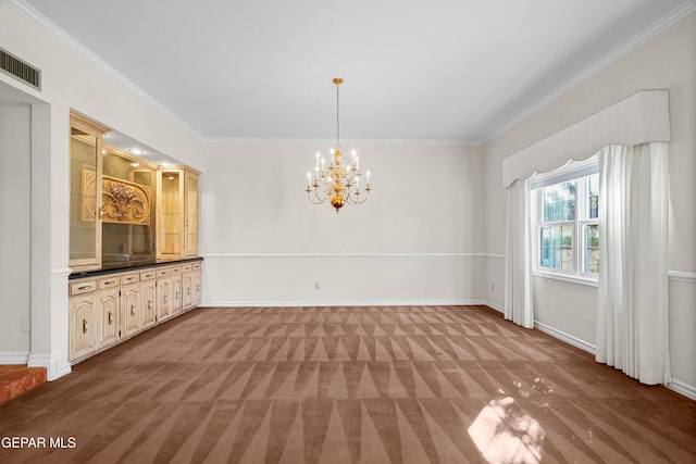 unfurnished dining area with an inviting chandelier, ornamental molding, and carpet floors