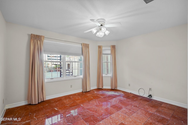 spare room featuring ceiling fan