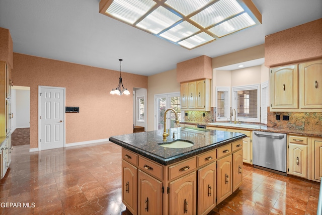 kitchen with tasteful backsplash, decorative light fixtures, sink, dishwasher, and a kitchen island with sink