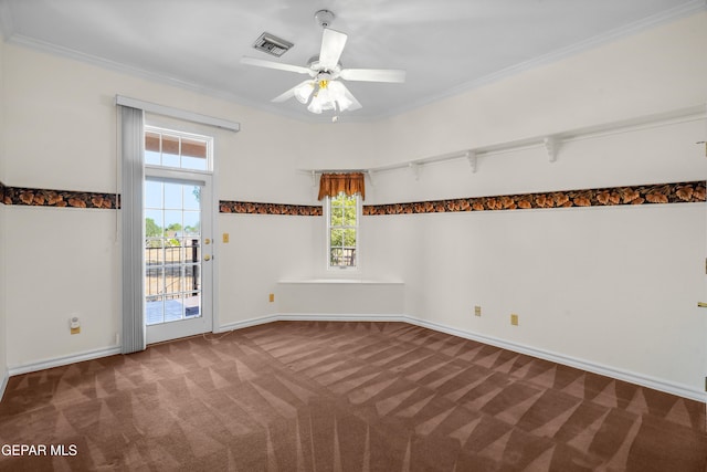 carpeted empty room featuring ceiling fan and crown molding