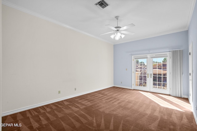 carpeted spare room with ceiling fan, french doors, and ornamental molding