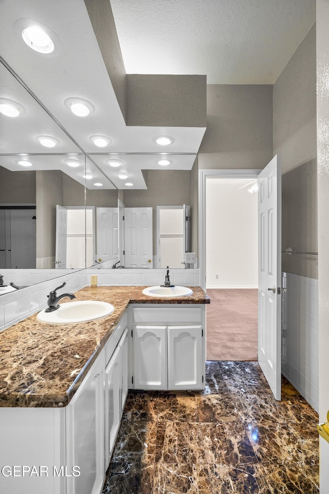 bathroom featuring vanity and a textured ceiling