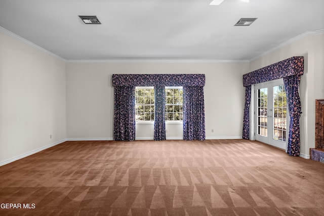 carpeted spare room with french doors and crown molding