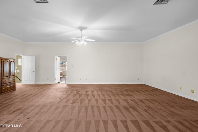 unfurnished room featuring light carpet, crown molding, and ceiling fan