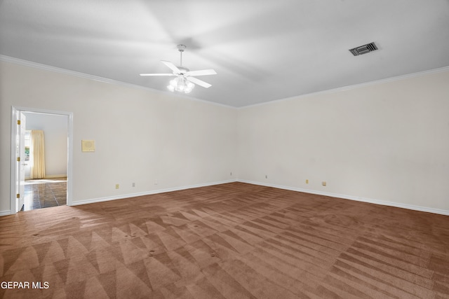 unfurnished room with ceiling fan, crown molding, and carpet