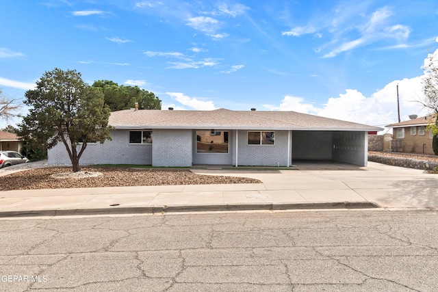 ranch-style house featuring a carport