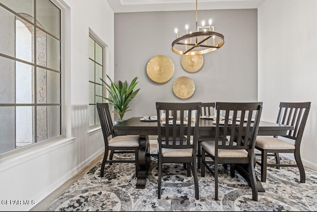 dining space with a chandelier and wood-type flooring