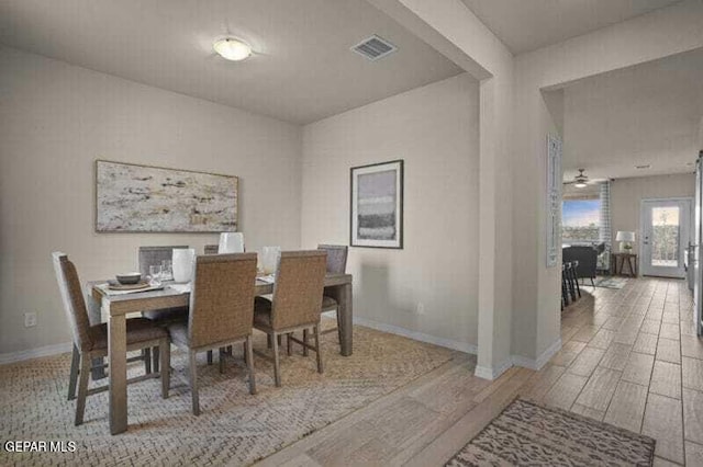 dining area with wood-type flooring