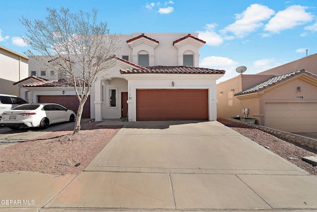 mediterranean / spanish-style home featuring a garage