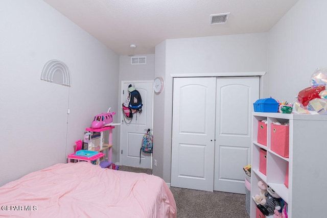 carpeted bedroom with a closet