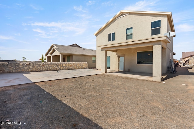back of property featuring a patio area