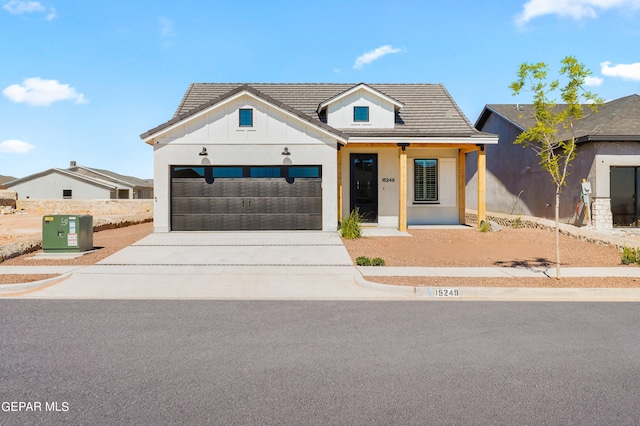 modern inspired farmhouse with a garage