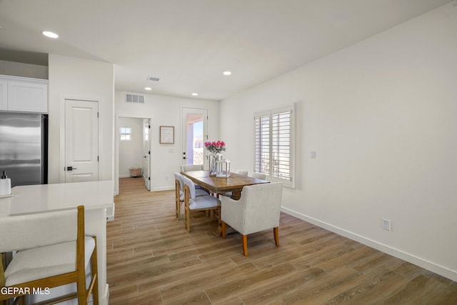 dining space featuring recessed lighting, baseboards, visible vents, and light wood-type flooring