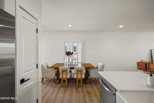 dining room featuring recessed lighting and light wood-type flooring