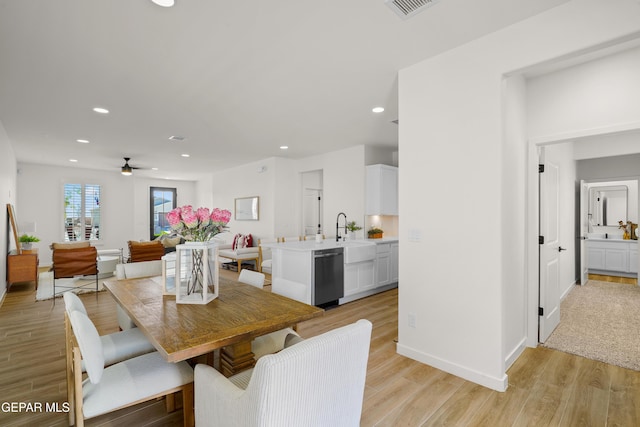 dining space featuring light wood-style floors, ceiling fan, baseboards, visible vents, and recessed lighting