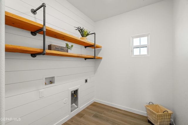 laundry area with wood finished floors, hookup for an electric dryer, baseboards, laundry area, and washer hookup
