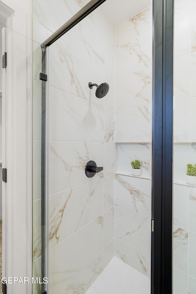 bathroom with a stall shower