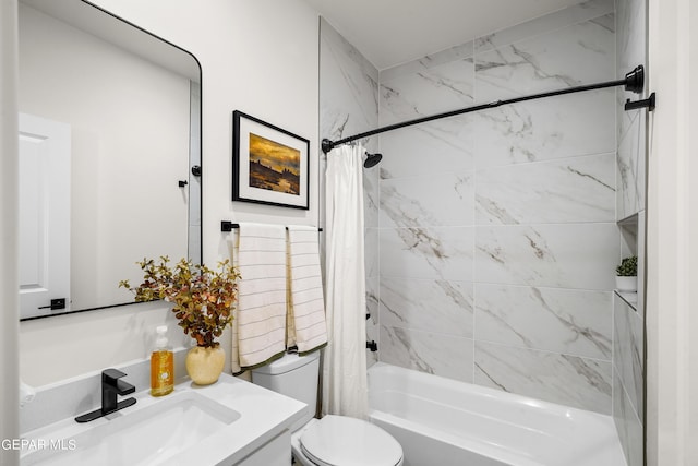 bathroom featuring shower / bath combo with shower curtain, toilet, and vanity